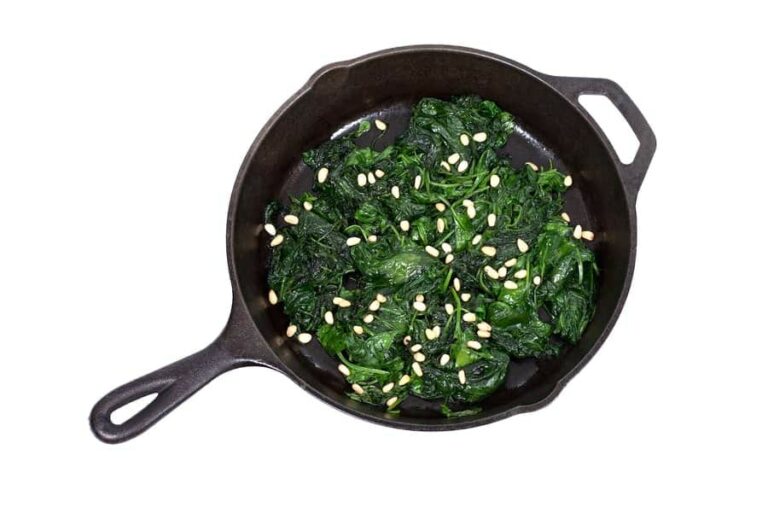 Photo of sauteed spinach and pine nuts in skillet from "Sauteed Garlic and Spinach" recipe from Green Smoothie Girl