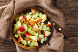 Photo of cut apples, celery, and raisins on plate from "Waldorf Salad" recipe by Green Smoothie Girl