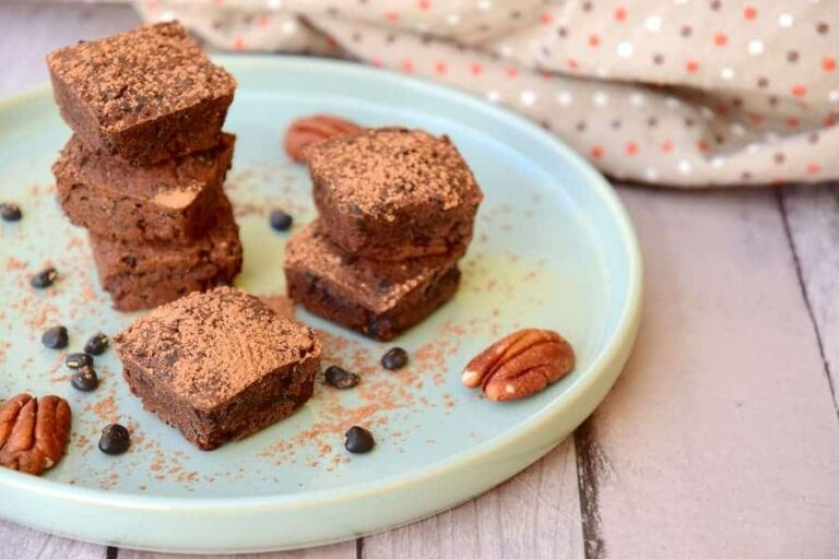 Photo of black bean brownies with nuts on place from "Dark Chocolate Black Bean Brownies" recipe by Green Smoothie Girl