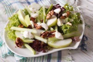 Photo of cut apples, celery, and raisins on plate from "Waldorf Salad" recipe by Green Smoothie Girl