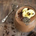 Photo of chocolate smoothie in glass with bananas and chia seeds from "Chocolaty Breakfast Smoothie" recipe by Green Smoothie Girl