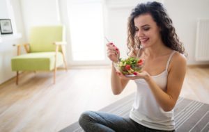 Photo of a woman eating a salad happily from "{VIDEO} How to Change Your Weight “Set Point” Forever" by Green Smoothie Girl