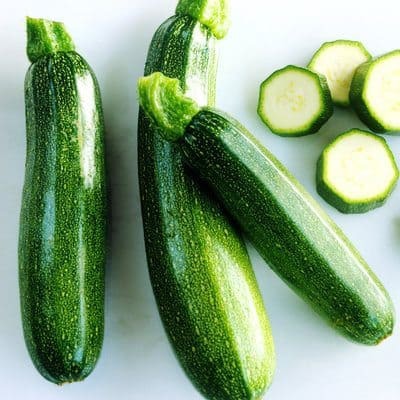 Whole and sliced courgettes