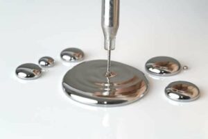 Photo of mercury being poured in a puddle from "Are Amalgam Fillings Safe? A Biological Dentist Weighs In" by Green Smoothie Girl