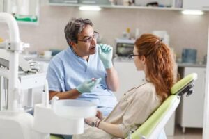 Photo of patient talking to her dentist from "Are Amalgam Fillings Safe? A Biological Dentist Weighs In" by Green Smoothie Girl