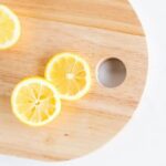 Photo of cut lemons on wood cutting board from "Mums’ Magical Antiviral Hot LemonAid Tonic" by Green Smoothie Girl