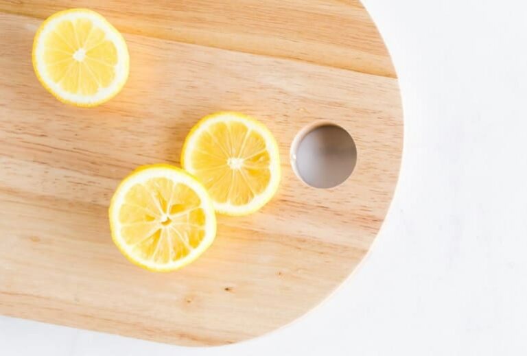 Photo of cut lemons on wood cutting board from "Mums’ Magical Antiviral Hot LemonAid Tonic" by Green Smoothie Girl