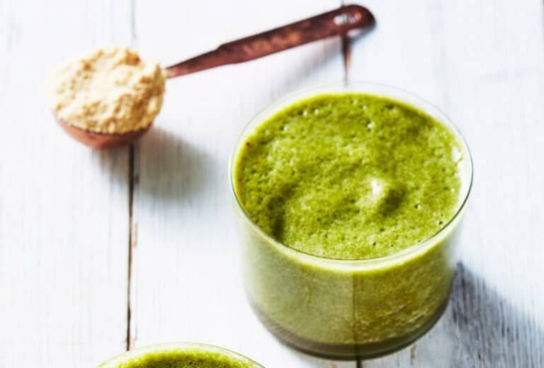 Photo of green smoothies top view with scoops of bone broth protein powder from "23 Ways to Use Bone Broth Protein" by Green Smoothie Girl