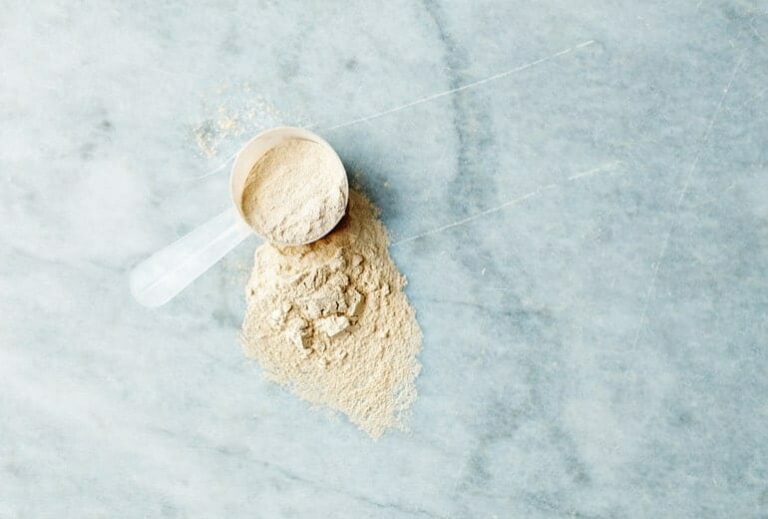 Photo of vanilla scoop of whey on marble background from "Whey Protein is Bad For You, Here's Why" by Green Smoothie Girl