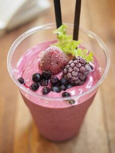 Photo of pink smooothie with frozen berries in it from "Brussels Smoothie" recipe by Green Smoothie Girl