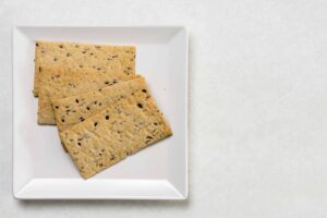 Image of flaxseed crackers on a white plate, from "3 Healthy Alternatives to Chips" at Green Smoothie Girl.