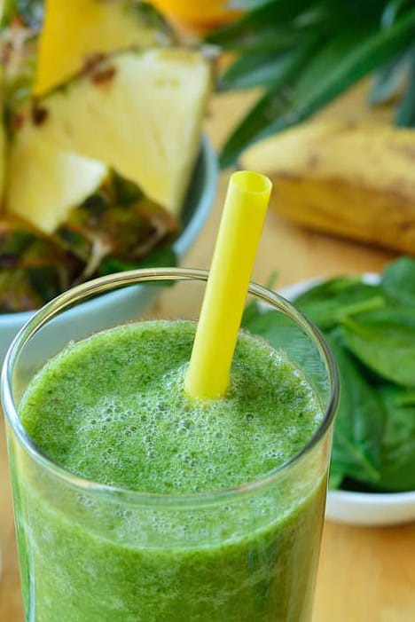 Photo of Green spinach and pineapple smoothie on table from "Turning Green Smoothie" recipe by Green Smoothie Girl