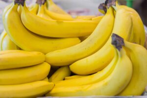 Photograph of bunches of bananas at a supermarket, from "Green Smoothies for High Blood Pressure Control" at Green Smoothie Girl.