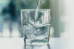 picture of water being poured into a glass cup