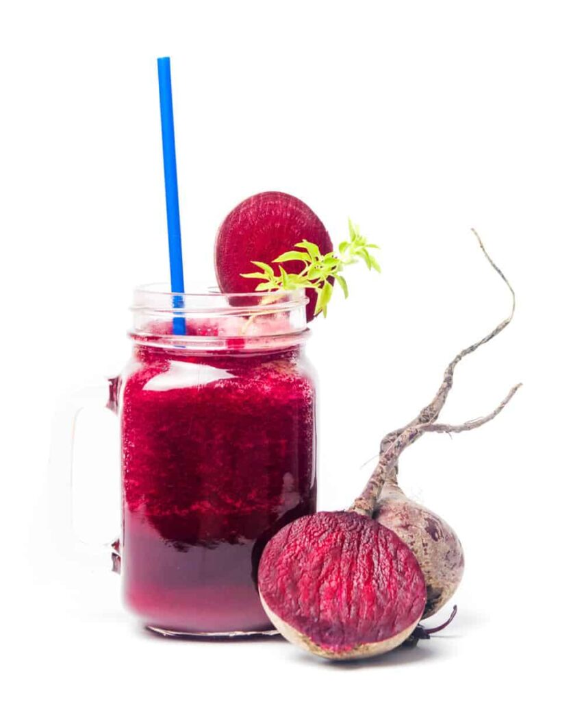 Photo of hot pink smoothie in jar with beet from "Green Smoothies For Crohn’s Disease: Research And Recipes" by Green Smoothie Girl
