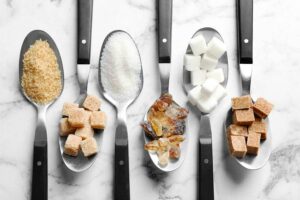 Photo of different sugars on spoons from "Why You Shouldn't Be Afraid Of Sugars In Whole Foods" at Green Smoothie Girl.