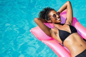 Photo of African American woman sunbathing "Sun Exposure, Sunburn Prevention, & 5 Effective Natural Sunburn Treatments" at Green Smoothie Girl.