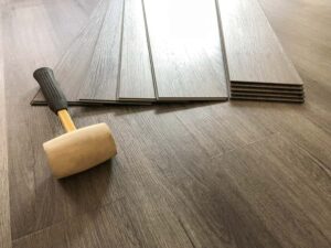 Photo vinyl flooring and application roller from "What To Do About Toxic Paint, Carpet, Furniture (Offgassing For Years!)" by Green Smoothie Girl