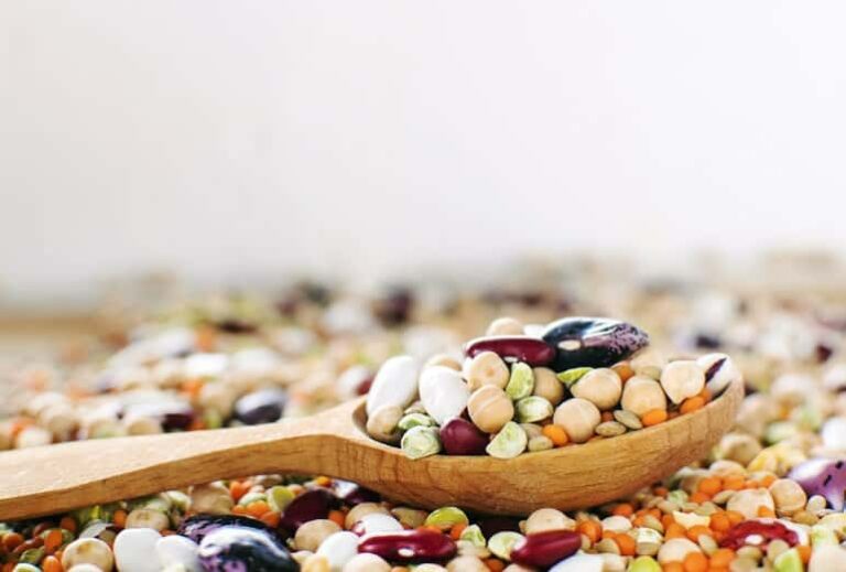 Photo of wooden spoon holding legumes from "How to Eat Legumes" by Green Smoothie Girl