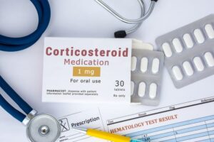 Photo of stethoscope, pills, and prescription for corticosteroid from "How To Recover From The Side Effects Of Prednisone And Other Corticosteroids" by Green Smoothie Girl