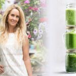 Photo of Robyn Openshaw smiling with hand on hip and stack of green smoothies from How To Make A Green Smoothie: The Foolproof Guide" by Green Smoothie Girl