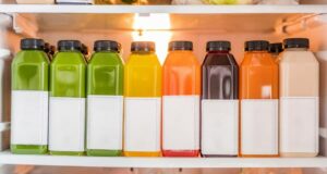 Photo of bottled label-less fruit juices in a row from "What Can You Drink During Modified Fasting? Tips, Recipes, and Best Practices" by Green Smoothie Girl