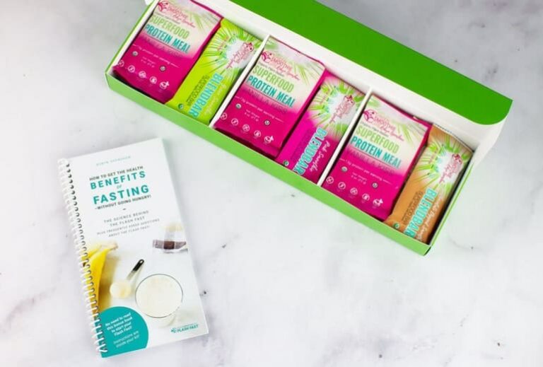 Photo of open Flash Fast kit box showing individual mini meals and fasting booklet from "Why I developed the Flash Fast" by Green Smoothie Girl