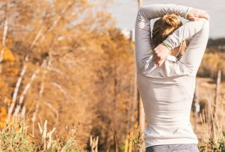 Photo of woman stretching arms before running from "15 Post-Workout Green Smoothies For Faster Recovery" by Green Smoothie Girl