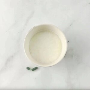 Photo of bowl of curdled milk on marble counter from "How to Test your Probiotic Supplement at Home"by Green Smoothie Girl