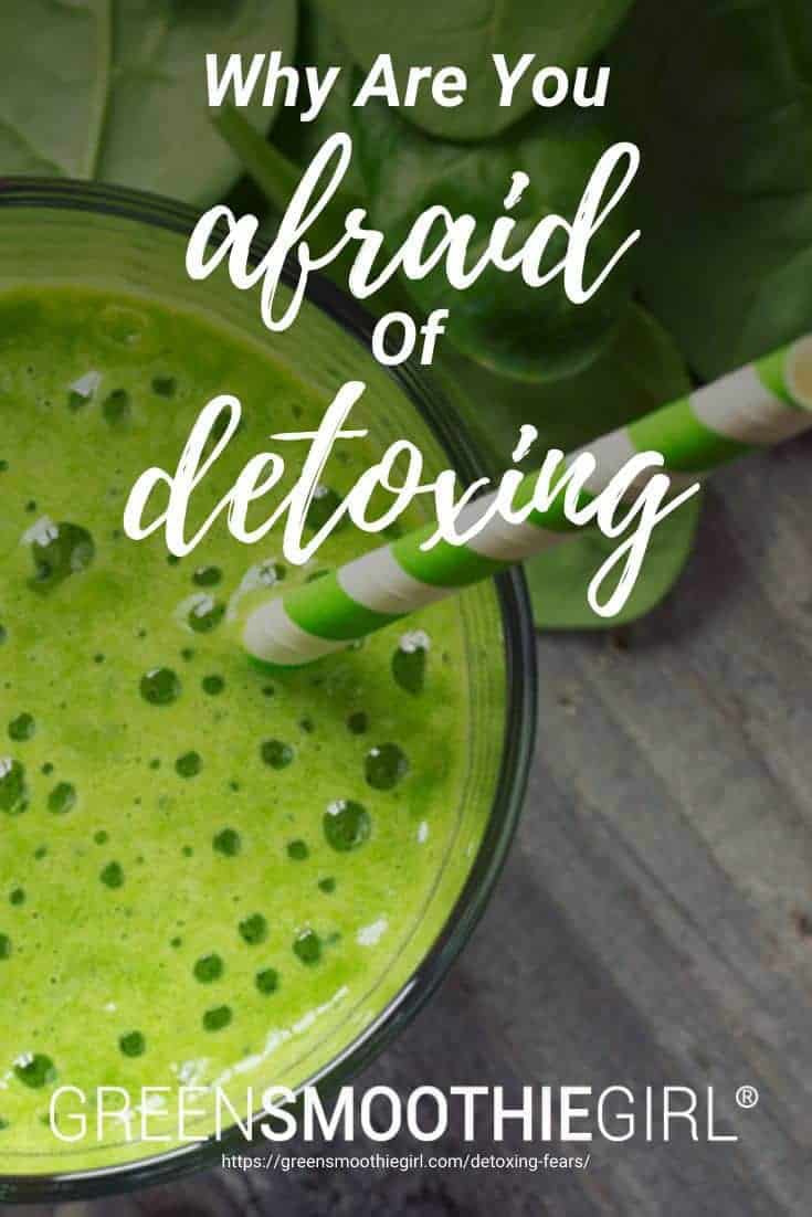 Photo of topdown view of green smoothie with green striped paper straw in it and spinach surrounding and post's title's text overlaid from "{VIDEO} Why Are You Afraid of Detoxing?" by Green Smoothie Girl