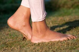 Photo of girl's bare feet walking on grass from 'Is EMF Making You Sick?" blog post by Green Smoothie Girl