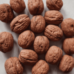 Several walnuts on a gray background