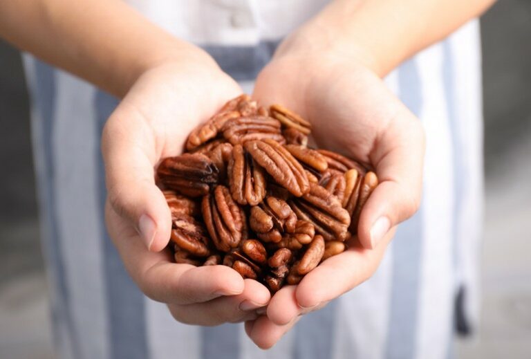 woman holding almonds