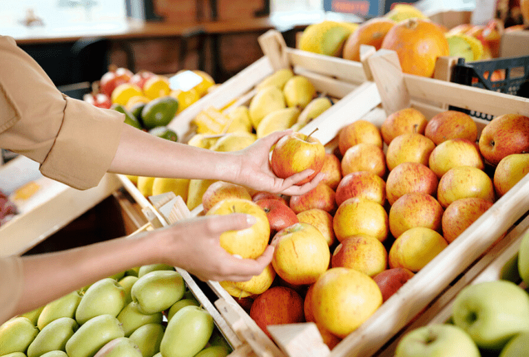 Woman shopping for apples